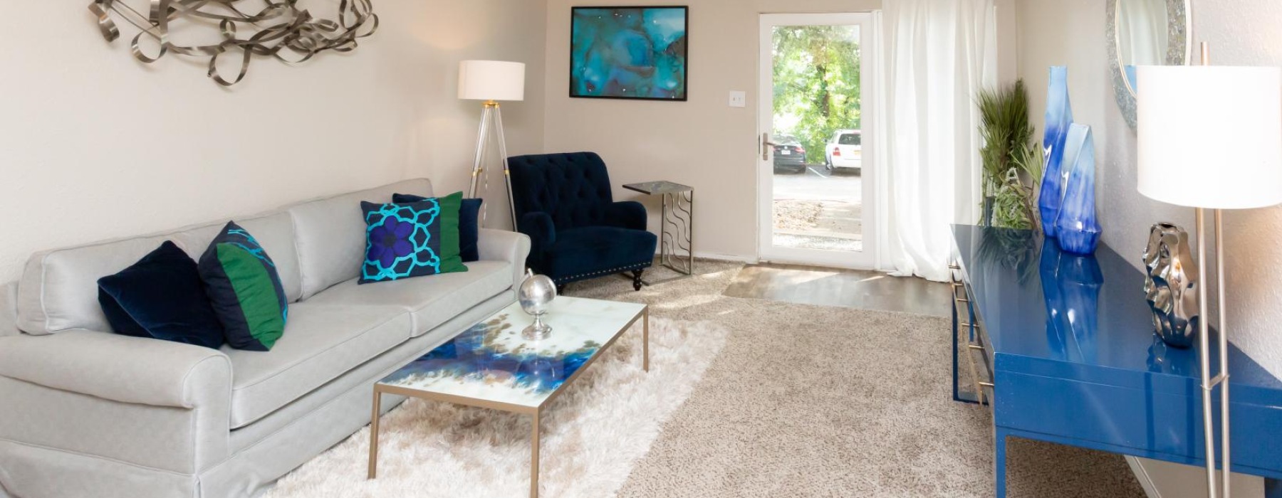 a living room with a white couch and a coffee table